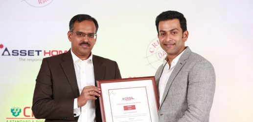 Sri. Prithviraj, brand ambassador of Asset Homes, receiving the CRISIL DA 2 Rating citation from Sri. Sudhir Nair.