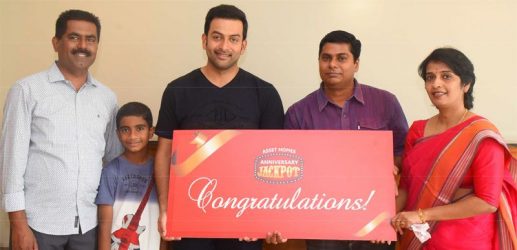 Asset Homes Anniversary Jackpot Winners Mr. Rajesh Pulikkal and Mini Rajesh along with Brand Ambassador Mr. Prithviraj and MD Mr. Sunil Kumar.