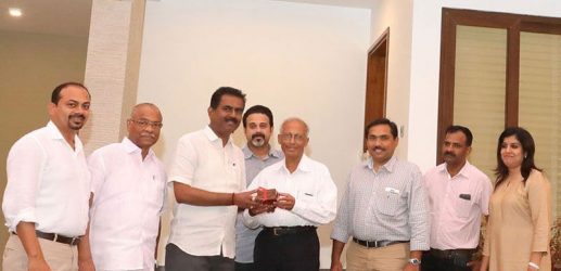 Sunil Kumar V., MD, hands over the key to the first completed villa of the Super Luxury Private Villa Project, Asset Insignia, to Dr. George Varkey Thalody.